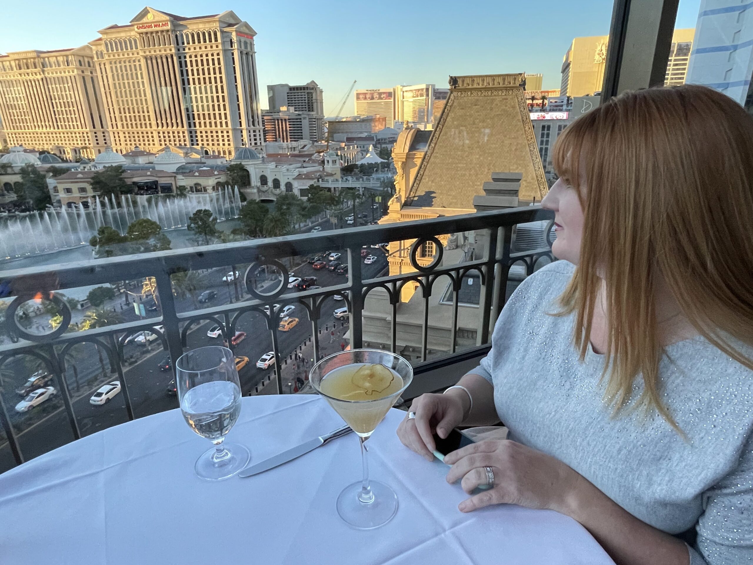 A woman looks at the Las Vegas Strip from the Eiffel Tower Restaurant.